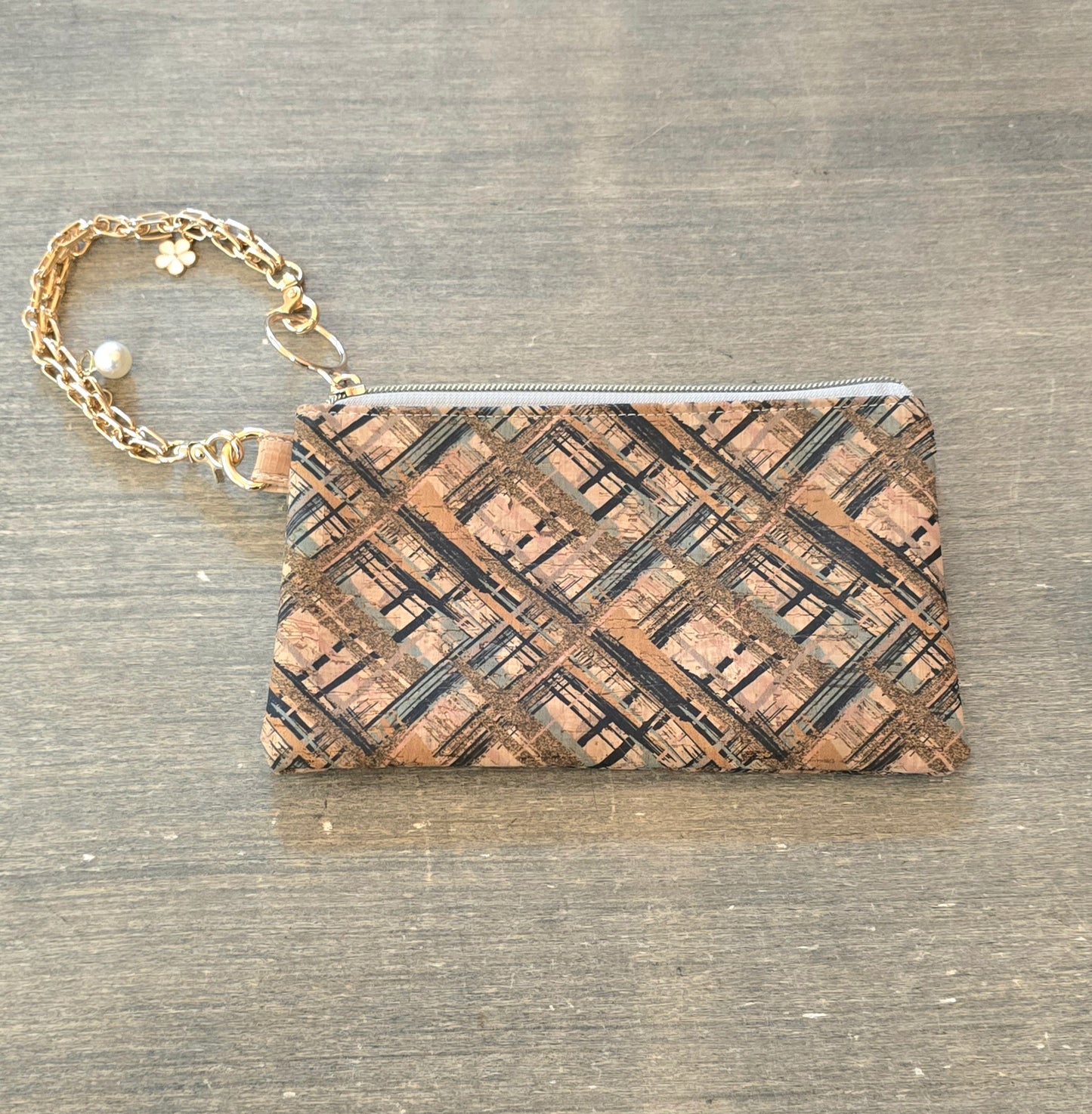 Wristlet bag with golden bracelet