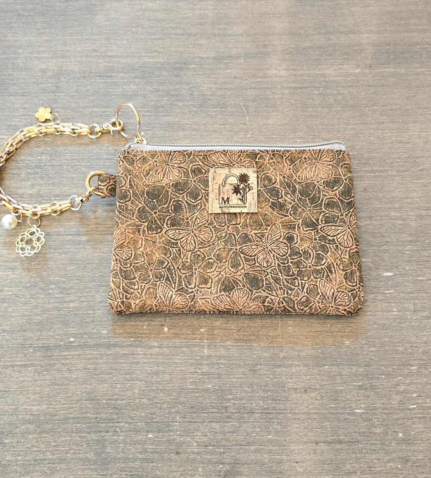 Wristlet bag with golden bracelet